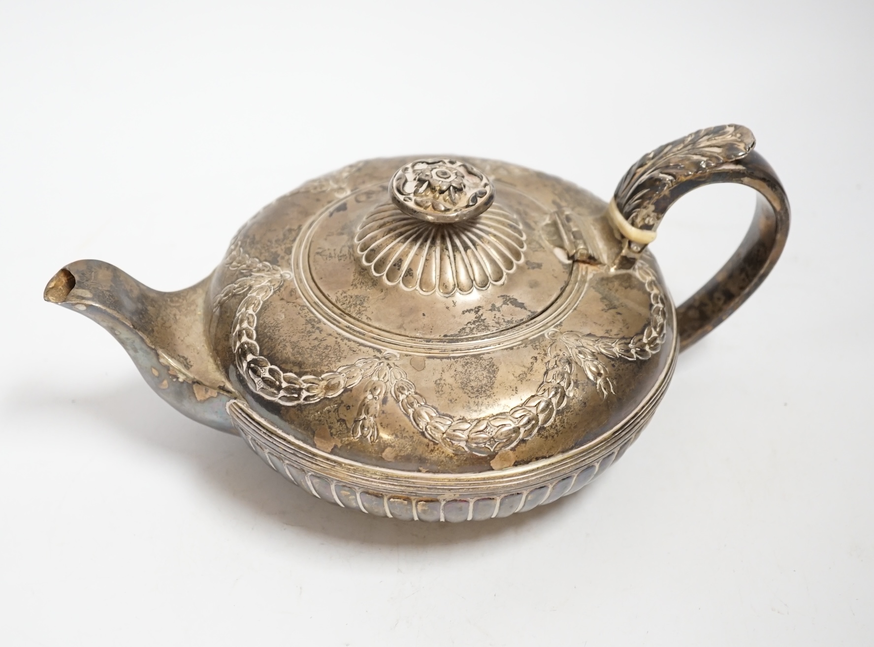 A George IV demi fluted silver squat circular teapot, Samuel Dutton?, London, 1826, gross weight 16.5oz CITES Submission reference A2RQDE6S